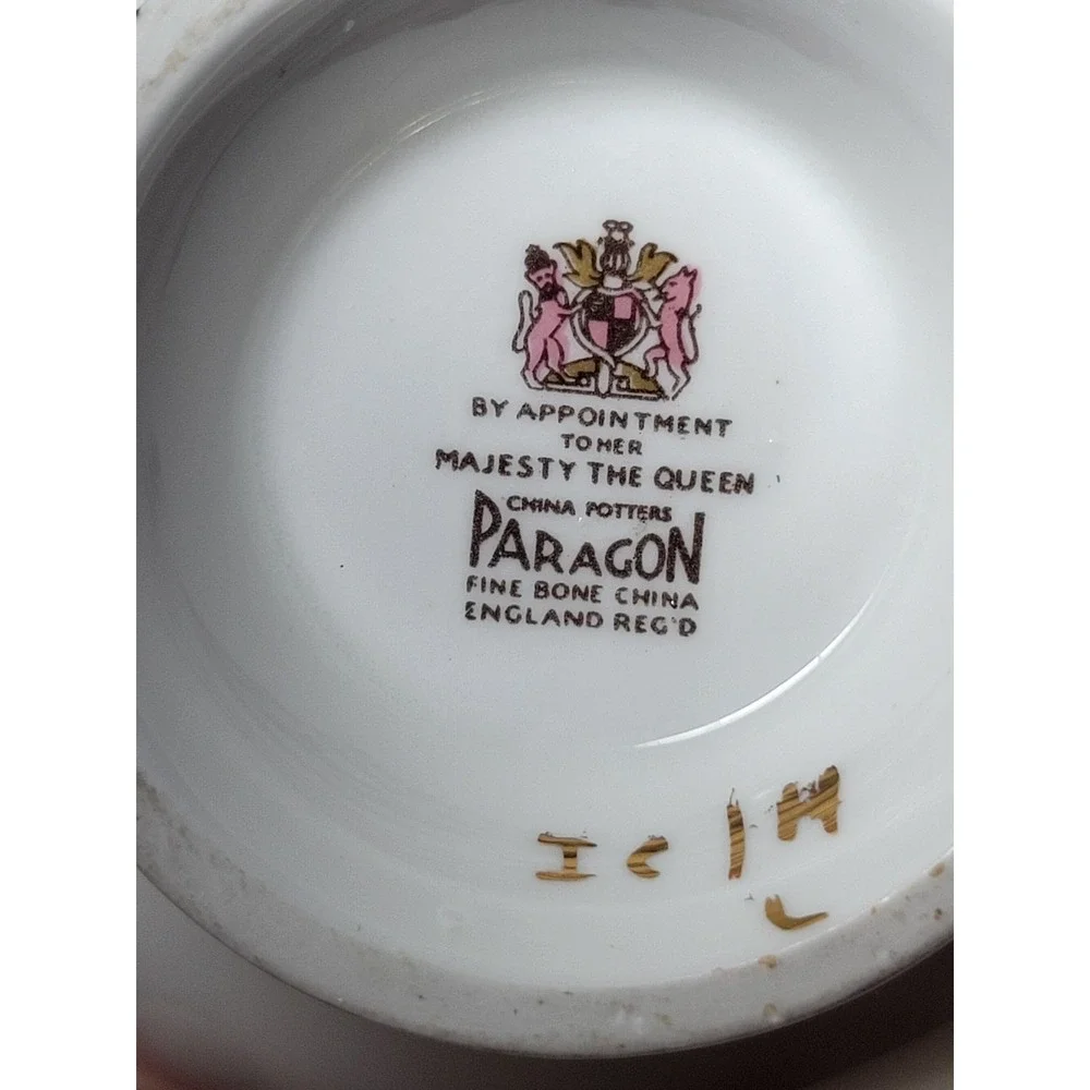 Paragon teacup - dark green panels on white background with floral‎ decor...Read